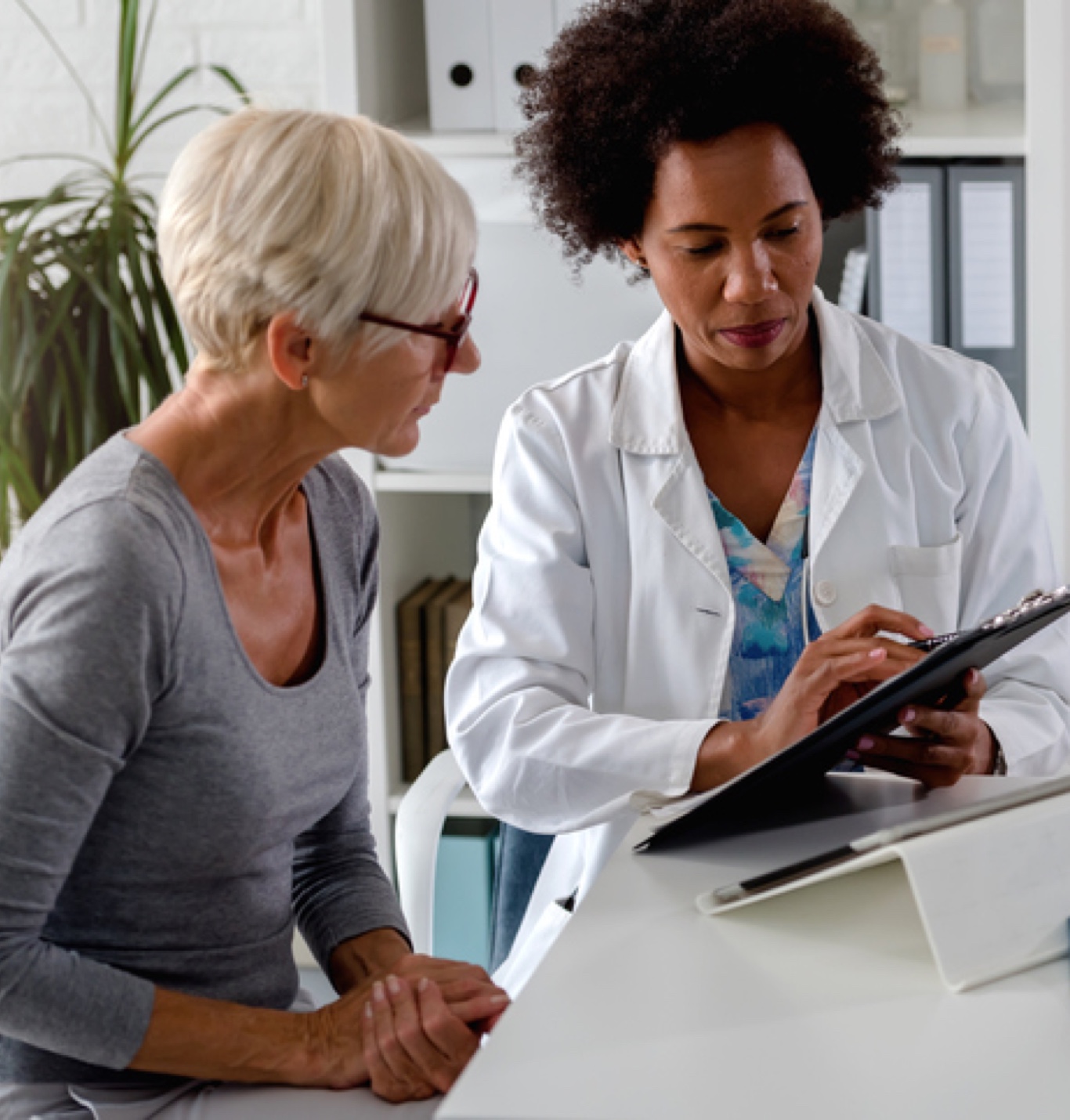 Stock photo of a doctor with a patient.